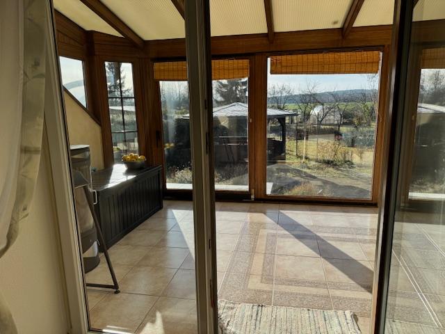 Wintergarten mit Kaminofen